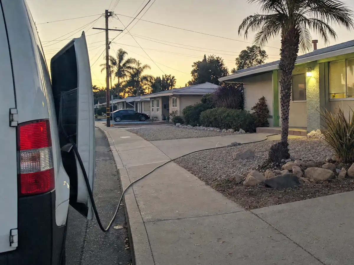 Service van arriving on a West Hollywood, CA street — local same-day coverage